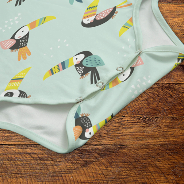 Toucans Green Onesie Snaps Closeup Mockup V1