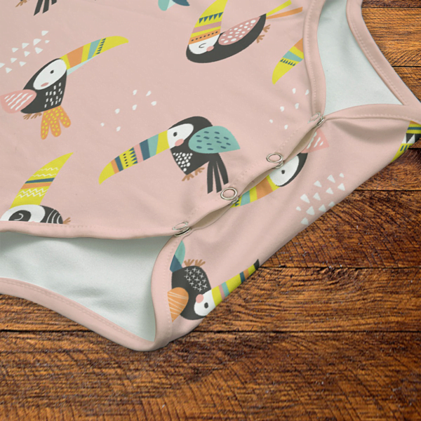 Toucans Pink Onesie Snaps Closeup Mockup V1