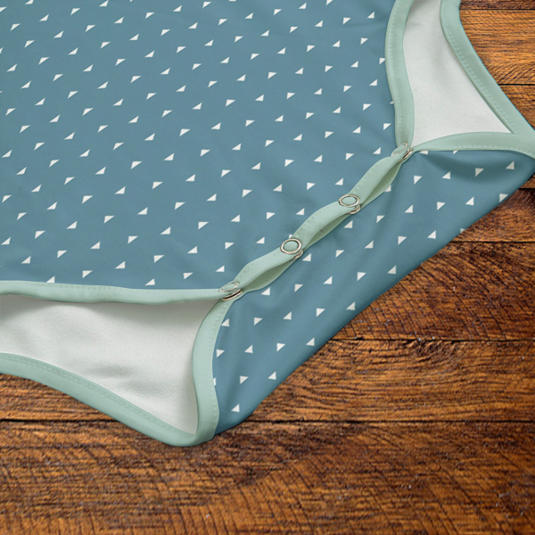 White Triangles Mint Green and Blue Onesie Snaps Closeup